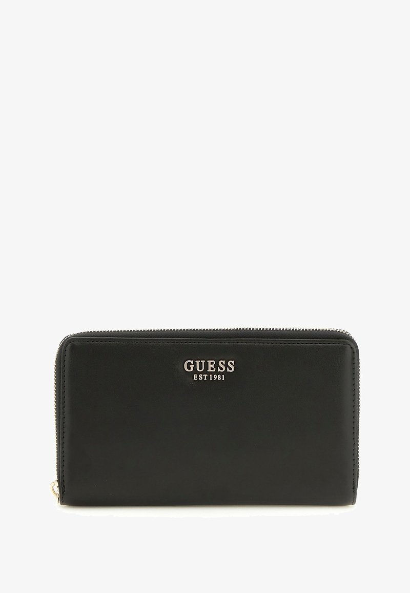 Portafoglio in pelle nera con chiusura zip, logo dorato "GUESS EST1981" e una texture liscia senza motivi visibili.