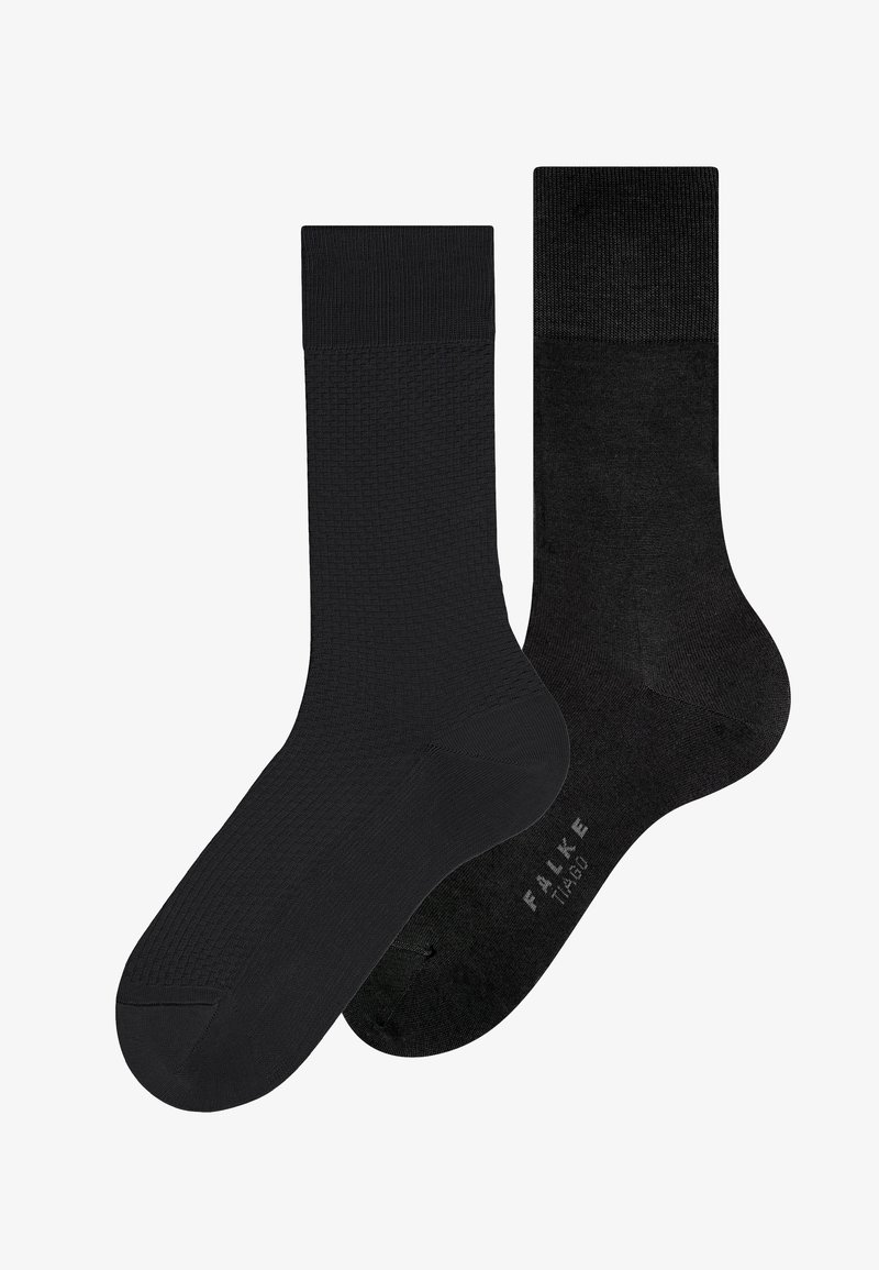 Deux chaussettes noires mi-mollet côte à côte, l'une avec un motif texturé et l'autre lisse avec "FALKE TIAGO" imprimé sur la semelle.