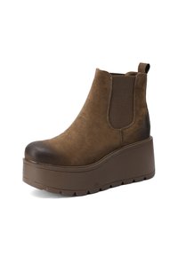 Stivale alla caviglia in suede marrone con punta arrotondata, pannelli laterali elastici e suola piatta marrone spessa, caratterizzato da un leggero gradiente sulla punta.