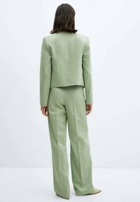 Mango Pantaloni - light green