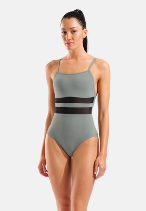 Costume intero verde con strisce orizzontali in rete nera, spalline sottili regolabili e una texture liscia ed elastica.