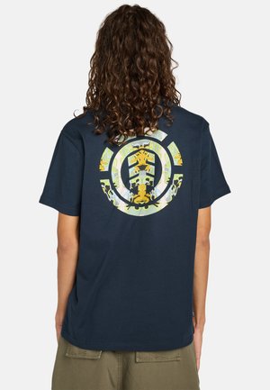 Navy blue cotton t-shirt featuring a large, detailed circular graphic in green and yellow on the back, showcasing a stylized design.