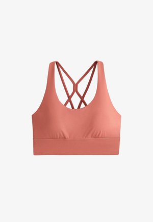 Reggiseno sportivo corallo con sottili spalline incrociate sul retro e una fascia larga di supporto sotto il busto.