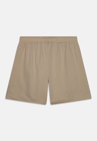 Beige treningsshorts med elastisk midje, laget av lett materiale, med en liten logo på venstre fremre side.