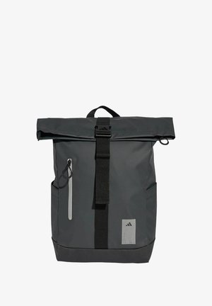 Black roll-top backpack made of waterproof fabric. Features a front zip pocket, adjustable strap, and a gray logo patch on the front.