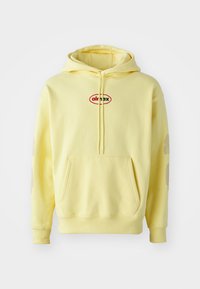 Yellow hooded sweatshirt made of soft fabric, featuring a central red and black "air max" logo, and subtle accents on sleeves.