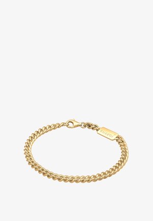 Arany lánc karkötő, amely összekapcsolt gyűrűkből áll, homár csattal és KUZZOI címkével ellátva. A felülete fényes és sima tapintású.