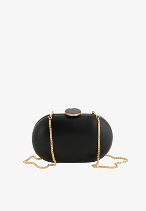 Sort oval clutch-taske med glat overflade, guldkæde-rem og rund sort-og-guld lås på toppen mod hvid baggrund.