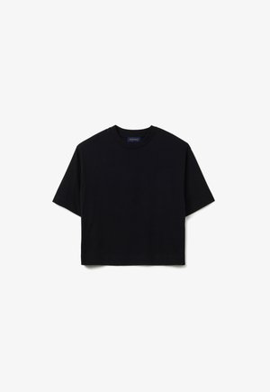 T-shirt noir, court, en coton. Doté d'un col rond et de manches courtes. Texture lisse, sans motifs ni embellissements.