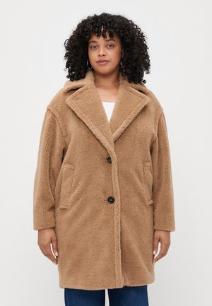 Brown, fluffy teddy coat with a notched collar, two side pockets, and button closure. Soft texture and relaxed fit.