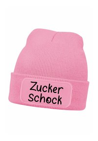 Pink knitted beanie with a folded brim. Features a rectangular patch with the text "Zucker Schock" in black. Soft texture, ribbed knit design.
