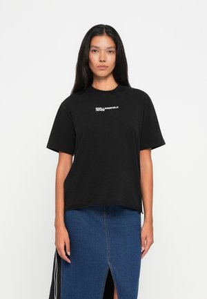T-shirt en coton noir à manches courtes, col rond, avec le logo "Karl Lagerfeld Jeans" imprimé sur le devant, coupe décontractée.