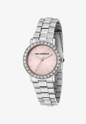 Silberne Metall-Uhr mit rundem Gehäuse, pinkem Zifferblatt, silbernen Stundenmarkierungen und einer Lünette, die mit klaren Steinen verziert ist. Armbandglieder aus Stahl.