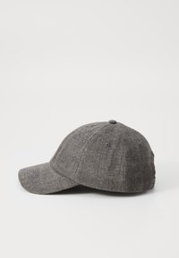 Gray fabric baseball cap with a curved brim, textured material, six-panel design, and eyelets for ventilation.