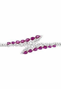 Purple teardrop gemstones and clear round diamonds create a zigzag pattern on a delicate silver band bracelet, featuring intricate detailing.