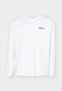 Langärmliges, weißes Baumwollhemd mit einem kleinen schwarzen "Levi's"-Logo auf der Brust. Klassischer Rundhalsausschnitt und Standardpassform mit gerippten Bündchen.