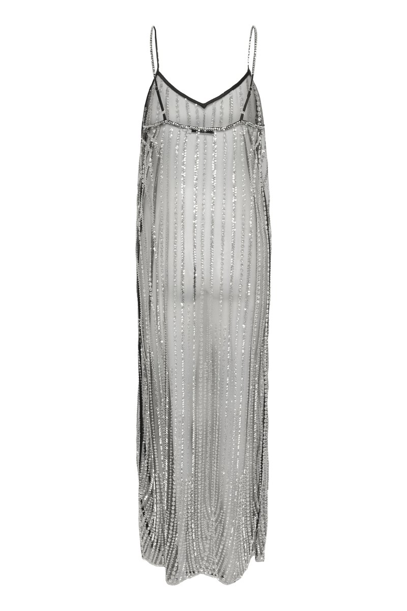 Sheer silver dress with vertical sequin stripes, thin black straps, and a flowing, loose silhouette. Features a V-neckline design.