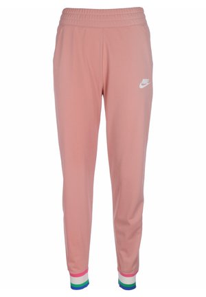 Jasnoróżowe spodnie dresowe Nike z elastycznym pasem i wielokolorowymi paskowanymi mankietami w kolorach białym, różowym, zielonym i niebieskim.