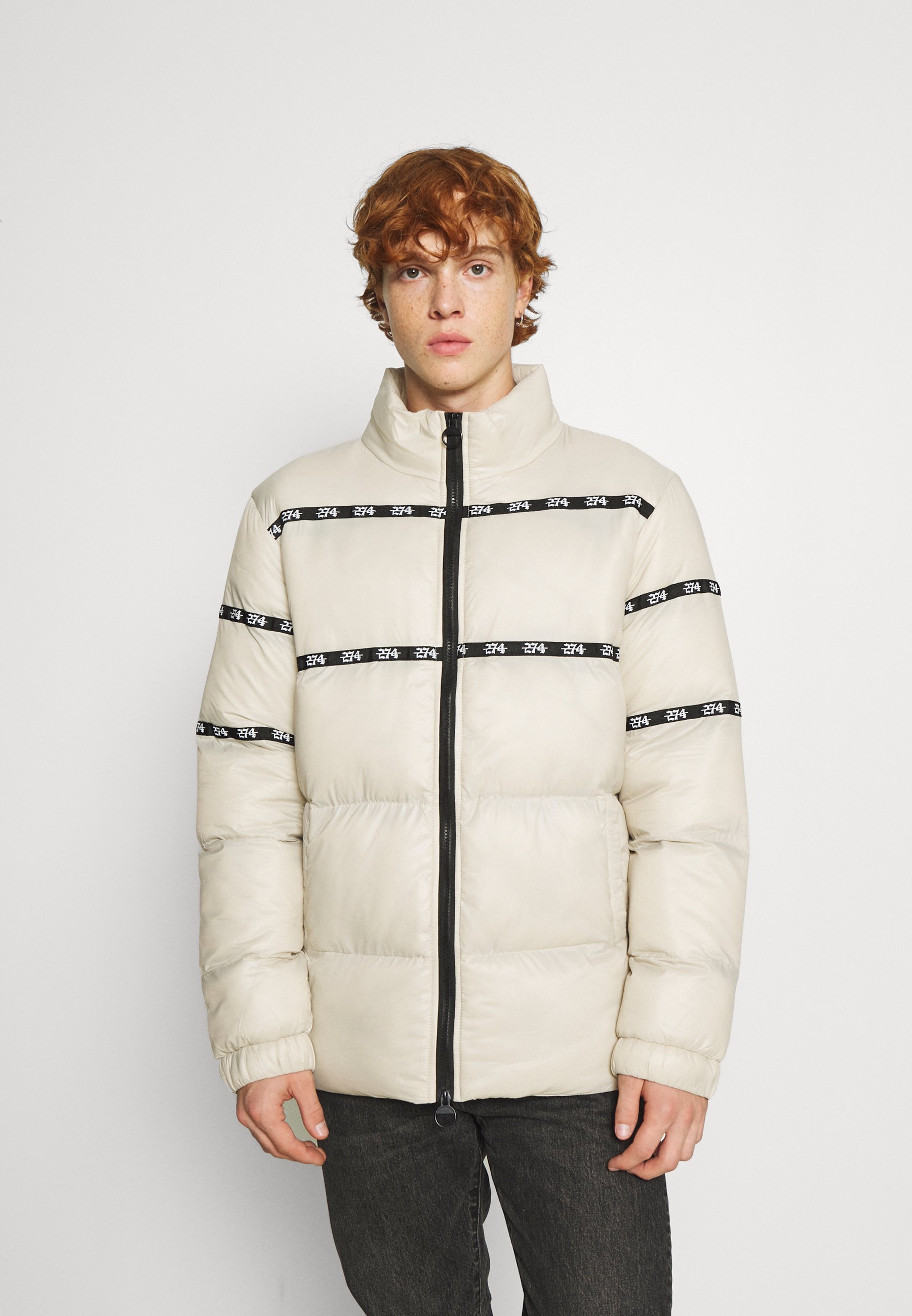 supreme taped puffer