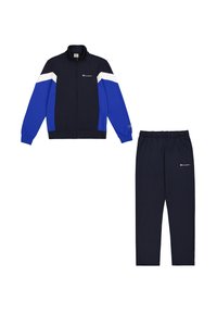 Tuta blu navy composto da giacca con zip, con accenti bianchi e blu e pantaloni abbinati, entrambi in tessuto liscio con dettagli del logo.