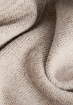 Tissu tricoté beige avec une surface douce et texturée. Présente un fin ribbing et un aspect lisse, légèrement duveteux.