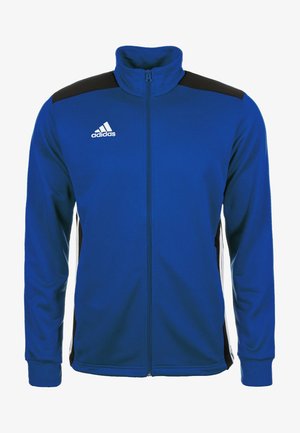 Veste de sport bleue avec col montant, fermeture éclair intégrale, accents noirs aux épaules et logo blanc. Tissu lisse et manches longues avec poignets élastiques.