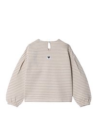 Haut crème à manches longues avec des rayures beige horizontales, encolure ronde, ouverture en forme de clé au dos et petit logo en forme de cœur en haut à gauche.