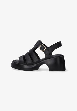 Black open-toe sandals with a chunky heel, featuring multiple straps and a side buckle for adjustable fit. Smooth leather texture.