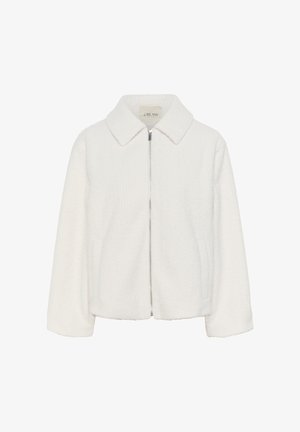 Veste blanche zippée en tissu texturé, dotée d'un col, de manches longues et de poches latérales, conçue avec une coupe légèrement raccourcie.
