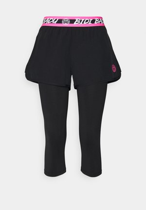Leggings de sport noirs avec shorts noirs attachés, ceinture rose avec le texte « BIDI BADY » et logo rose sur le côté gauche des shorts.