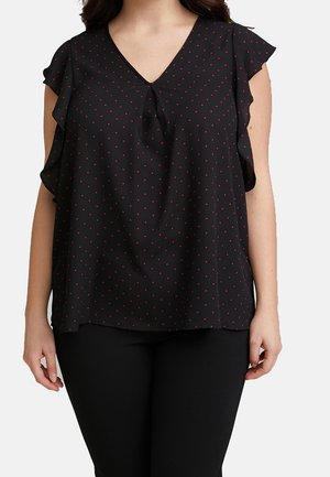 Blusa nera con maniche corte a volant, scollatura a V e pois rossi. Tessuto leggero con taglio morbido e dettaglio con fiocco nella parte anteriore.