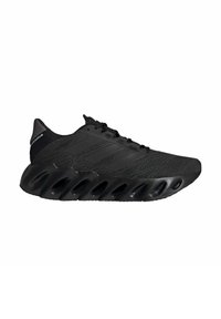 Black athletic shoes feature a knit upper, textured fabric, three signature stripes, and a distinctive segmented sole for cushioning.
