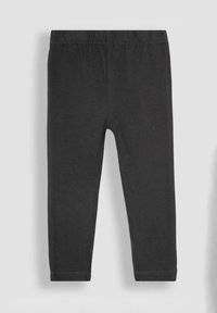 Fekete leggings sima, rugalmas anyagból. Rugalmas derékkal rendelkezik, és testhezálló fazonú, látható minták vagy díszítések nélkül.