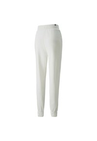 Pantaloni della tuta bianchi con design affusolato, vita elastica e polsini. Tessuto morbido con dettagli di cucitura minimi e un piccolo etichetta del logo.