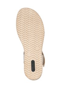 Sandal sole with a herringbone tread pattern. Light brown rubber with a black logo and size imprint, featuring a rounded heel and smooth edges.