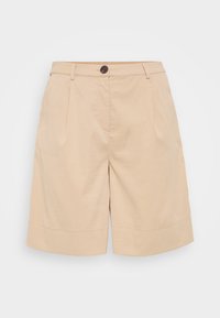 Shorts de algodón beige con un diseño ajustado, que presentan un cierre de botón, plisados en la parte frontal y un dobladillo enrollado para mayor detalle y estructura.