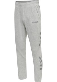 Hellgraue Jogginghosen aus weichem Stoff mit Seitentaschen, einem elastischen Bund und einem strukturierten Chevron-Muster an den Seiten.