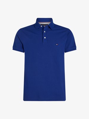 Blue polo shirt made of cotton, featuring a collared neckline, two buttons, and a small embroidered logo on the chest. Short sleeves.