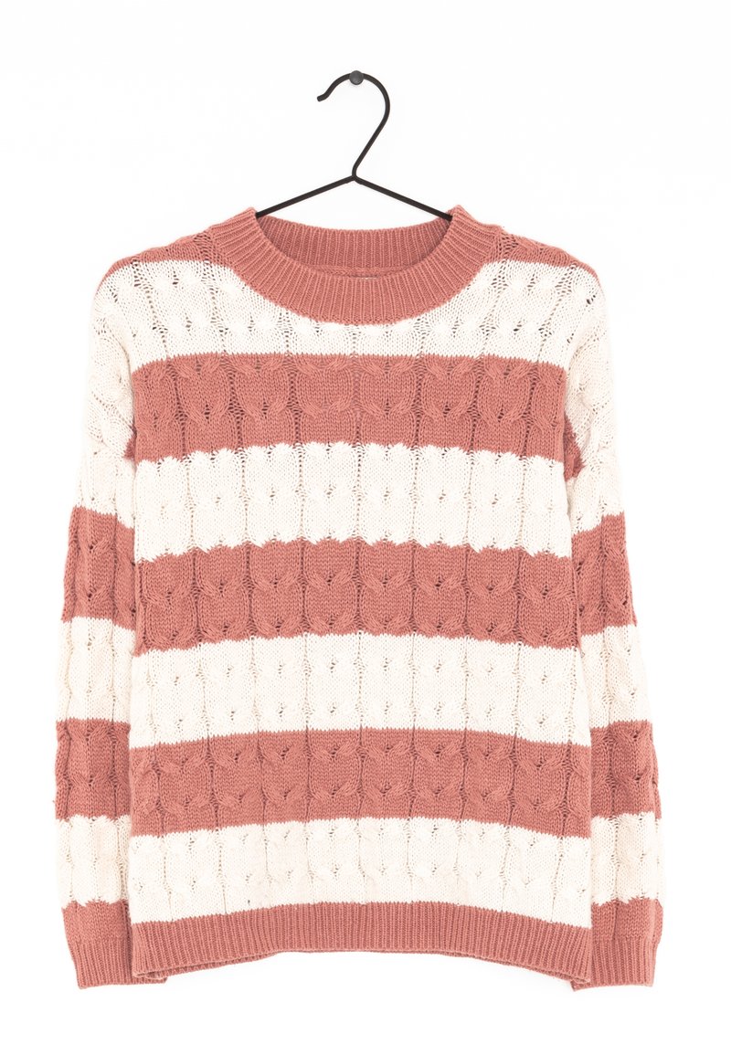 Knit sweater featuring alternating coral and cream horizontal stripes, textured cable pattern, and a crew neck. Hangs from a black hook.