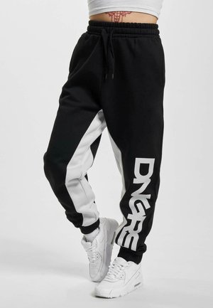 FORCE  - Tracksuit bottoms - black