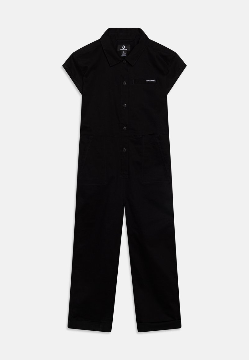 Combinaison noire à manches courtes avec col, boutons avant, deux poches avant et un petit logo Converse sur la poitrine.