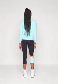 Endless LINE POCKET - Háromnegyedes sportnadrágok - black aqua