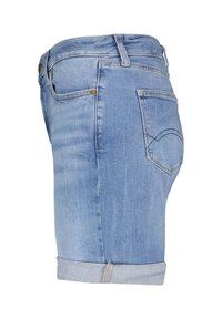 Světlé modré džíny s krátkým střihem, s obepínajícím designem, s ohrnutým lemem, zadními kapsami a jemnými švy.