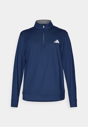 Pullover a maniche lunghe blu navy con colletto zip a mock, realizzato in tessuto morbido. Presenta un logo Adidas bianco sul lato sinistro del petto.