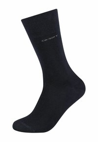 Calze nere realizzate in un materiale liscio e elastico. Presentano un polsino a coste e un logo sottile stampato di lato. Forma standard delle calze.