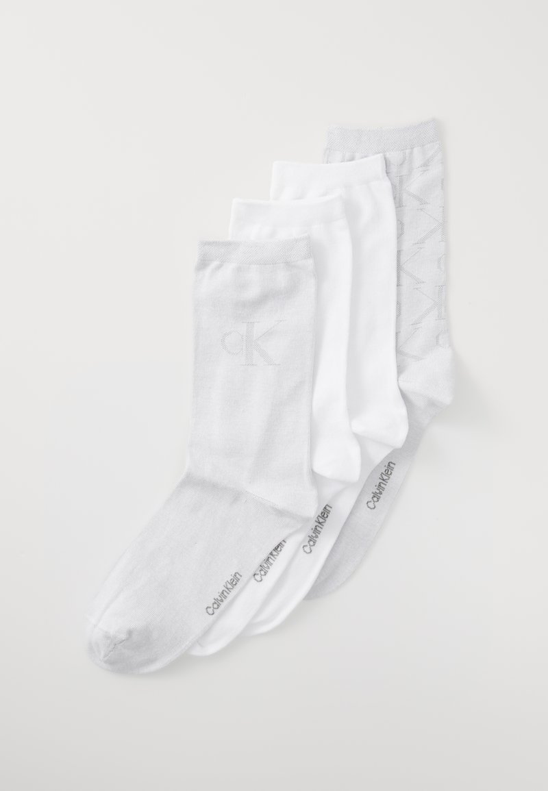 Neli paari sokki valges ja heledates hallides toonides. Puuvillane segu, erinevad tekstuurid, Calvin Klein brändinguga jalatallas ja küljel.