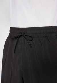 Puma STUDIO FOUNDATION SHORT - Spordišortsid - black