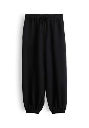 Pantaloni neri a vestibilità ampia con cintura elastica, coulisse, tasche laterali e polsini elastici alle caviglie su sfondo bianco.