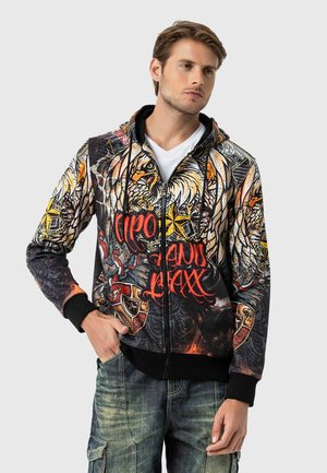 Hoodie mit Reißverschluss, ausgestattet mit einem lebhaften grafischen Print mit Tiermotiven, roten Akzenten sowie gerippten Bündchen und Saum. Hergestellt aus einem Stoff mit glatter Textur.