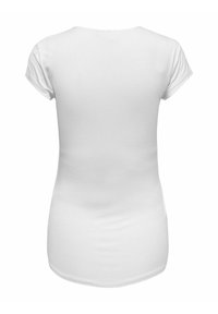 T-shirt bianco a maniche corte, scollo rotondo, realizzato in morbido cotone, design aderente, si estende leggermente sotto i fianchi.